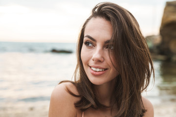 Poster - Image of happy caucasian woman smiling and looking aside