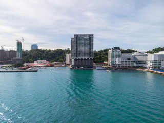 Wall Mural - Kota Kinabalu cityscape aerial  photo with fisherman boat parking at Waterfront Kota Kinabalu. Kota Kinabalu is the capital of Malaysia’s Sabah state.