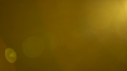 Wall Mural - abstract motion of warm light colors over black background