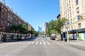 Poster - In the streets of South Manhattan, in the distance the most famous skyscrapers of New York