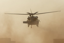 Military Chopper Takes Off In Combat And War Flying Into The Smoke And Chaos And Destruction. Military Concept Of Power, Force, Strength, Air Raid. Portrait View.