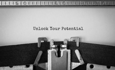 Aufkleber - Text Unlock Your Potential typed on retro typewriter