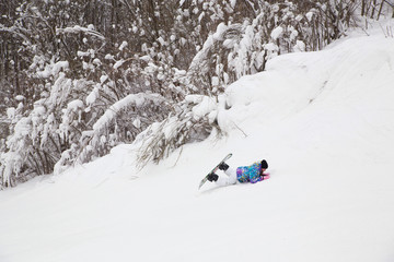 Wall Mural - Young woman  snowboarders learning skates  in a ski resort