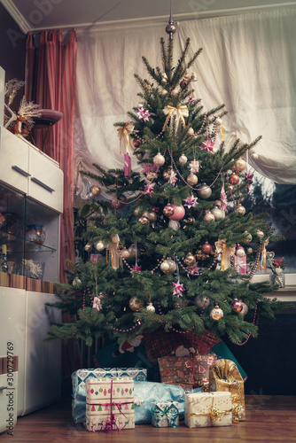 It Is Holy Night The Decorated Christmas Tree Is In The Living Room And Below Are The Wrapped Christmas Presents Authentic Picture Of Private Party Buy This Stock Photo And Explore