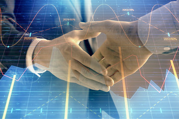 Multi exposure of forex graph on abstract background with two businessmen handshake. Concept of success on stock market