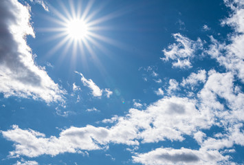 blue sky with clouds and sun