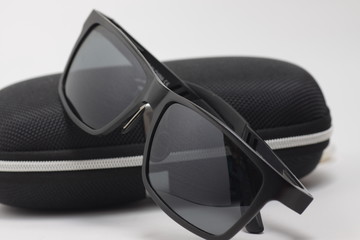 Black sunglasses on a white background