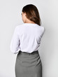 beautiful woman office manager posing in a new casual white blouse and classic straight dark skirt