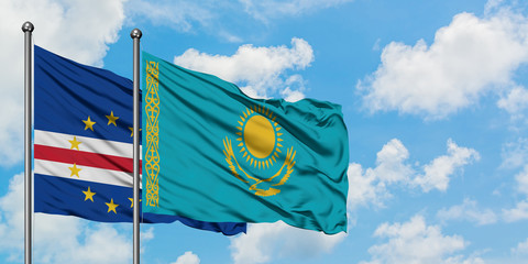 Cape Verde and Kazakhstan flag waving in the wind against white cloudy blue sky together. Diplomacy concept, international relations.