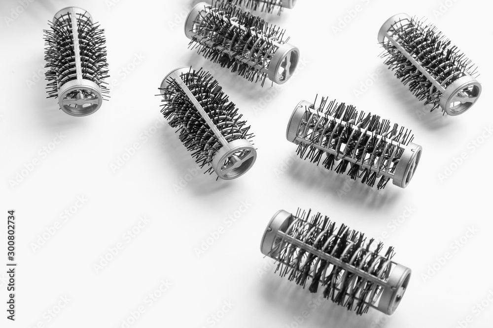Hair curlers on white background
