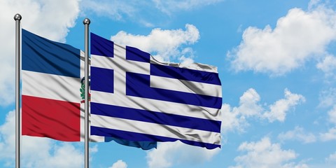 Dominican Republic and Greece flag waving in the wind against white cloudy blue sky together. Diplomacy concept, international relations.