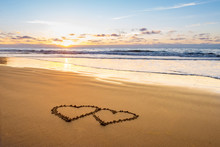 Valentines Day On Sunny Beach. Two Hearts Drawn In Sand, Love Concept