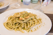 Busiate With Pistachio Pesto And Shrimps Served In A Restaurant In Sicily, Italy