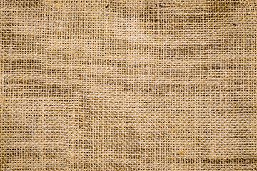 Wall Mural - Rough hessian background with flecks of varying colors of beige and brown. with copy space. office desk concept, Hessian sackcloth burlap woven texture background.