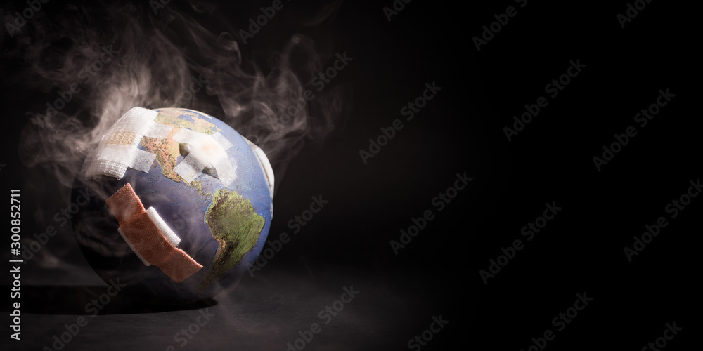 White smoke cover around the globe (World) full of bandages, demonstrating impact of global warming, climate change, pollution from Fossil Fuels Burning, Deforestation, Industrial Revolution. - obrazy, fototapety, plakaty 