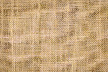 Rough Hessian Background With Flecks Of Varying Colors Of Beige And Brown. With Copy Space. Office Desk Concept, Hessian Sackcloth Burlap Woven Texture Background.