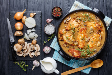 Chicken Marsala in a black ceramic dish