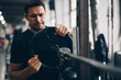 © mlasaimages - authentic image, fit man lifting weights, barbell overhead press. concept of weight loss and healthy living.