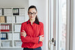 © contrastwerkstatt - Self-assured young businesswoman wearing glasses
