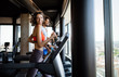 © NDABCREATIVITY - Picture of people running on treadmill in gym