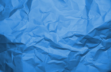 Blue crumpled paper texture background.