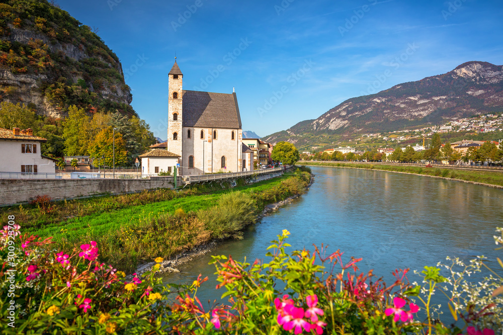 Beautiful scenery of Trento city with Saint Apollinare church at Adige river, Northern Italy - obrazy, fototapety, plakaty 