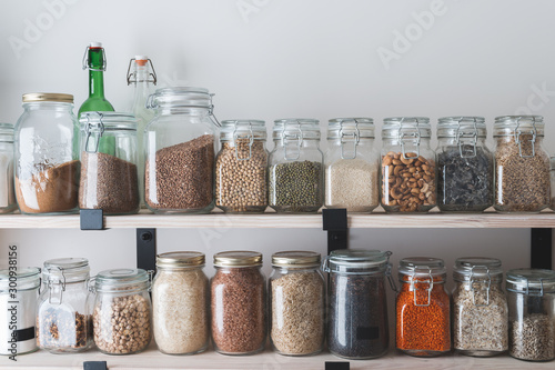 shelves with glass jars filled with groceries Tableau sur Toile