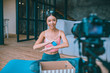 © zinkevych - Slim fitness blogger filming video about massage ball