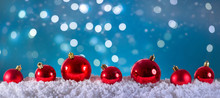 Red Christmas Balls On Snow