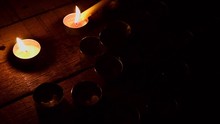 Lighting Group Of Candles In The Dark