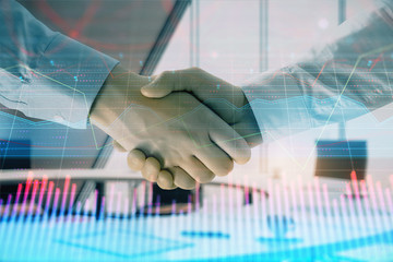 Multi exposure of financial graph on office background with two businessmen handshake. Concept of success in business