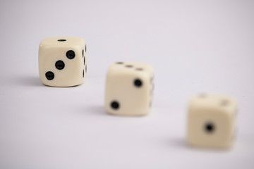 White dice with black dots in white background