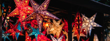 Festive Lightning Decorations, Colorful Star Lanterns Hanging On European Christmas Market.