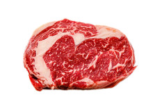 A Rib Eye Steak Of Marbled Grain-fed Beef Lies On A White Background. Isolated.