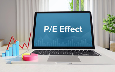 P/E Effect – Statistics/Business. Laptop in the office with term on the display. Finance/Economics.