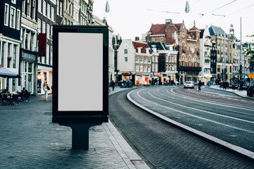 Wall Mural - Clear Billboard on city street with blank copy space screen for advertising or promotional poster content, empty mock up Lightbox for information in Amsterdam, blank display outdoors in urban area