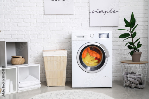 Fotomural Interior of home laundry room with modern washing machine