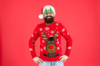 © be free - Sweater with deer. Clothes shop. Buy festive clothing. Holidays accessories. Hipster bearded man wear winter sweater and hat. Knitted sweater. Happy new year. Christmas spirit. Winter party outfit