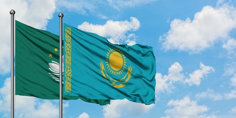 Macao and Kazakhstan flag waving in the wind against white cloudy blue sky together. Diplomacy concept, international relations.