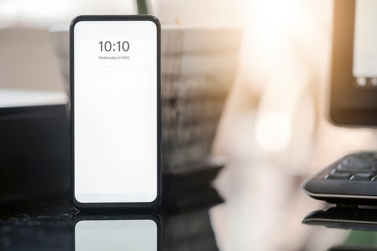 Mockup smartphone with blank screen on table, copy space for your graphic design.