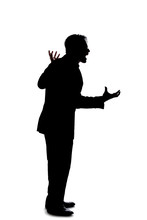 Silhouette Of A Backlit Model Posing As A Businessman On A White Background.  He Is Shouting In Anger And Is Furious