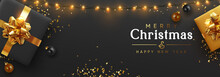 Christmas Banner. Background Xmas Design Of Sparkling Lights Garland, Realistic Gifts Box, Black Balls And Glitter Gold Confetti. Horizontal Christmas Poster, Greeting Cards, Headers Website