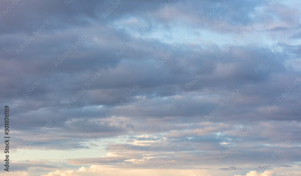 Clouds in the sky at sunset as a background - obrazy, fototapety, plakaty 