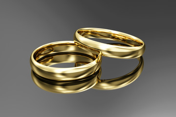 Wall Mural - Golden Wedding Rings on black reflective background. 3D Rendering