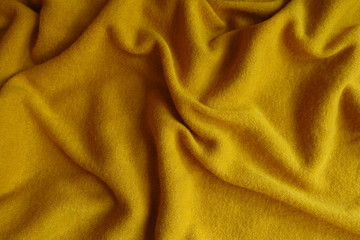 Sticker - Mustard yellow woolen fabric in soft folds