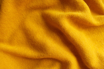 Sticker - Orangey yellow knitted woolen fabric in soft folds