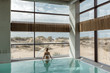 © Alena Ozerova - Girl relaxing in luxury swimming pool in modern hotel