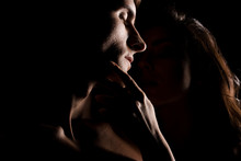 Beautiful Sexy Couple Hugging, Isolated On Black With Backlight