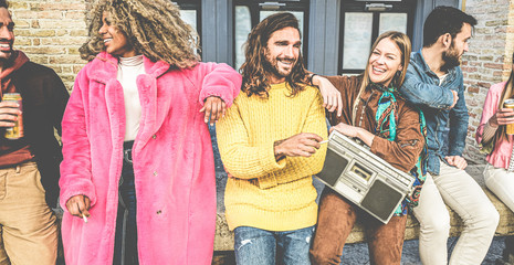 Trendy people making party outdoor drinking beer, smoking cigarettes and listening music - Young students friends having fun on weekend day - Erasmus and fest concept - Focus on center guys faces