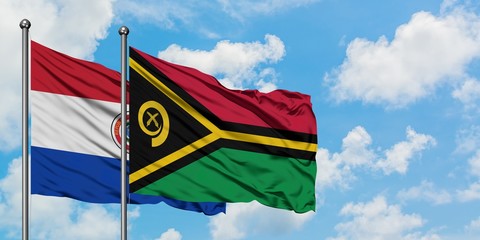 Paraguay and Vanuatu flag waving in the wind against white cloudy blue sky together. Diplomacy concept, international relations.